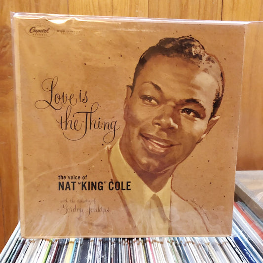 Nat King Cole . Love is the thing
